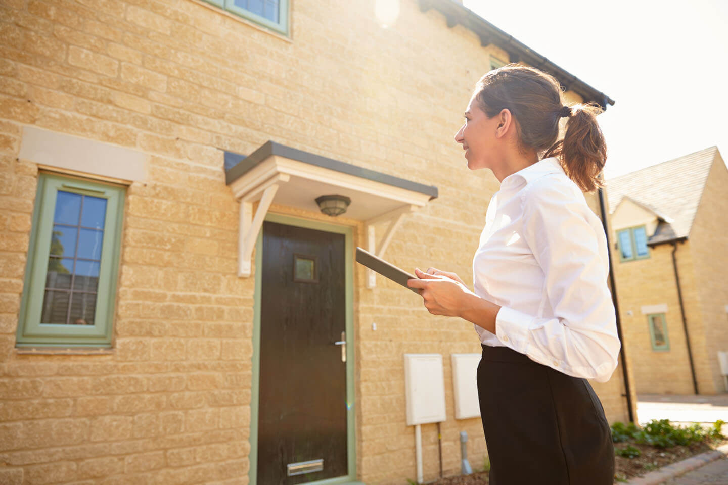 A solicitor reviewing the outside of a property