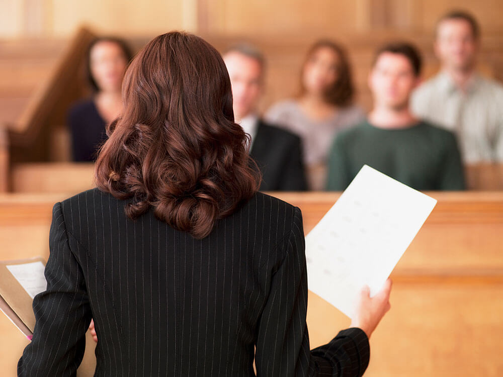 A solicitor in court talking to the jury