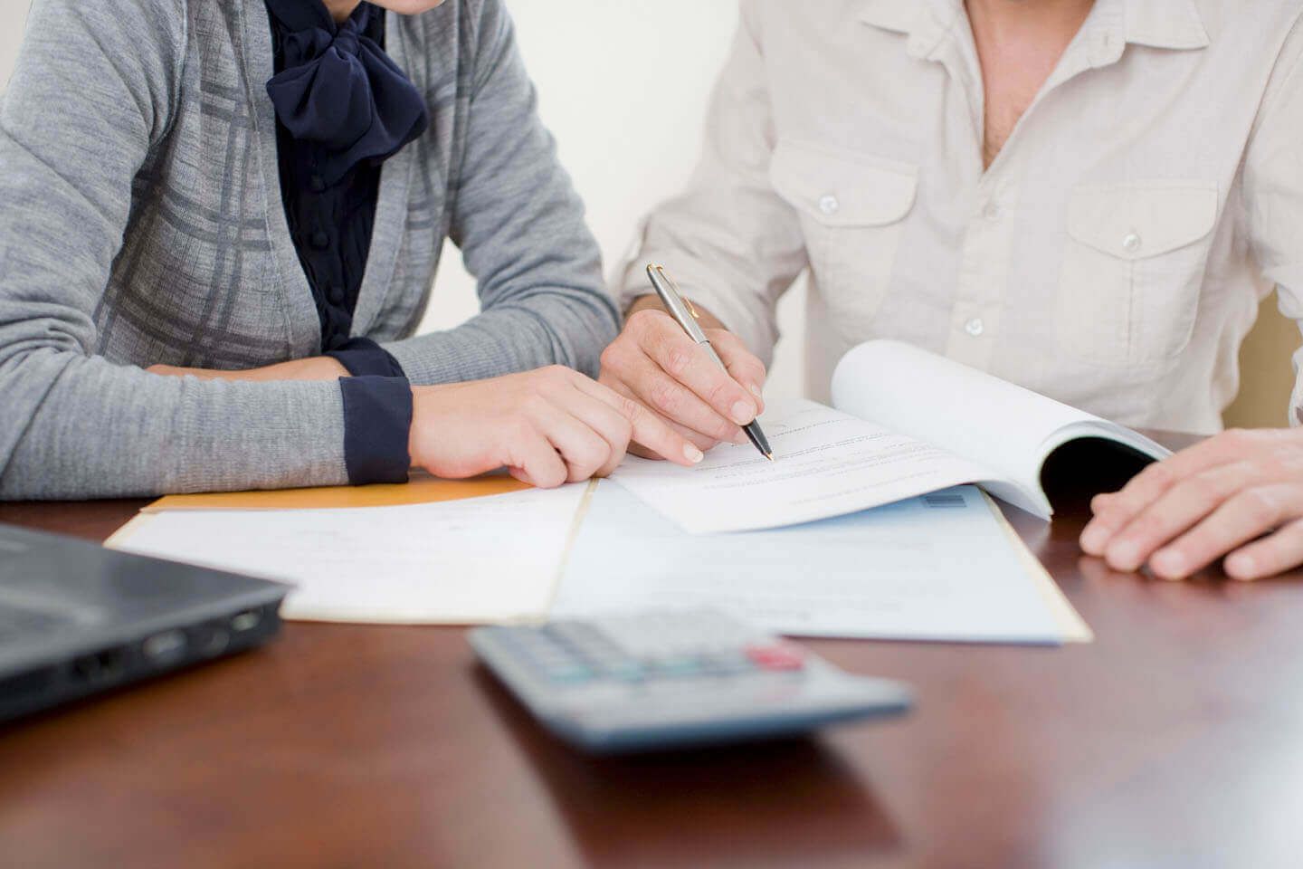 Two solicitors discussing documentation