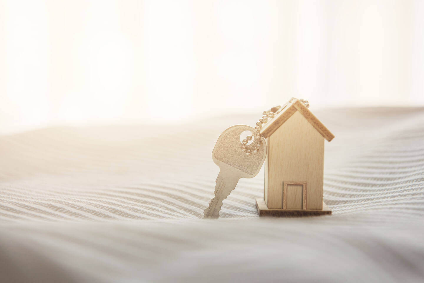 a key on a wooden house keyring