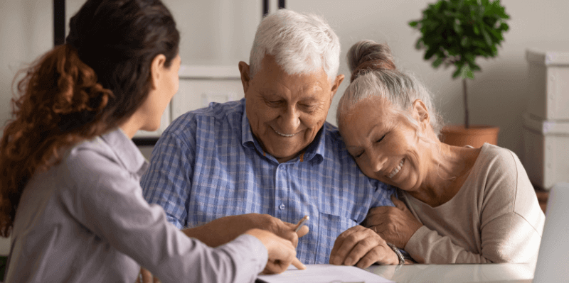 elderly couple making a will with a solicitor