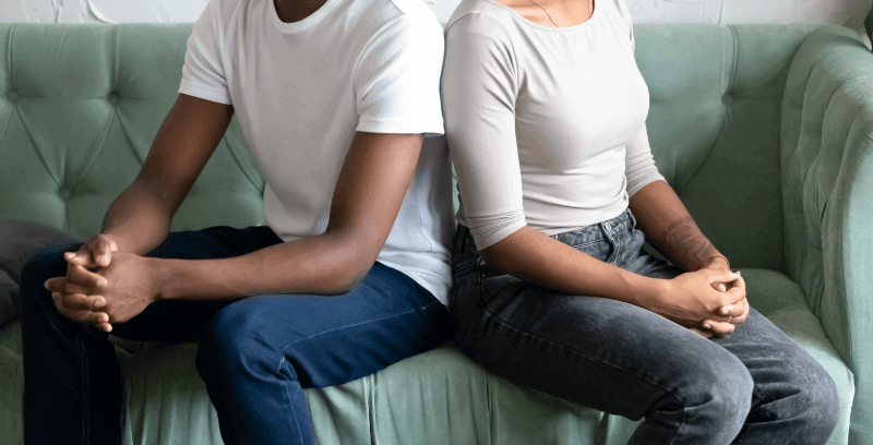 Divorced couple sitting on a sofa