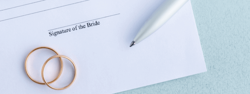 prenuptial agreement form with two wedding rings on it